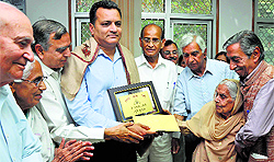 Shailender Singh being presented with the Prof Ram Nath Shastri Memorial Award in Jammu on Wednesday