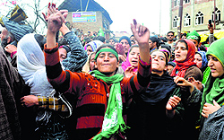 Supporters of the Peoples Democratic Party dance during the election campaign rally of party president and candidate from Anantnag Mehbooba Mufti at Noorabad in Kulgam district on Tuesday