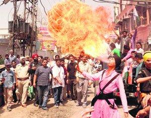 A youth performs at a roadshow of Congress candidate Capt Amarinder Singh in Amritsar on Wednesday.