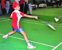 A player in action during a badminton tournament at the Sports Stadium in Sector 42, Chandigarh, on Wednesday. Tribune photo: Parvesh Chauhan