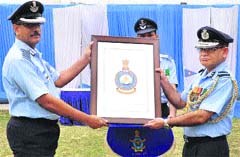 Gp Capt Amit Goel receives the distinctive crest from Air Vice Marshal Sumit Nath Mukerjee, Assistant Chief of Air Staff (Education), at 3 BRD in Chandigarh on Wednesday. A Tribune photograph