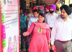 Deputy Commissioner Tejinder Pal Singh Sidhu during a photo exhibition on voter awareness at Phase I in Mohali on Wednesday. A Tribune photograph