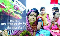 Former AAP members sit on a dharna against the AAP leader Arvind Kejriwal at Jantar Mantar in New Delhi on Wednesday. Now they support the BJP prime ministrial candidate Narendra Modi
