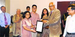 Governor NN Vohra presents an award to a student at Raj Bhawan in Jammu on Wednesday. A Tribune photograph