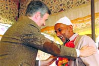 Chief Minister Omar Abdullah greets a National Conference supporter at a rally in Kulgam district on Wednesday. Tribune photo: Amin War