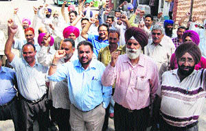 Members of the Punjab Roadways Mulazim Action Commitee protest in Jalandhar Wednesday