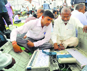 Poll officials check EVMs in Moradabad on Wednesday.
