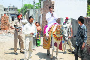 Independent candidate Sushil Kumar Jindal canvasses on a horse in Dhobiana Basti in Bathinda on Wednesday. 