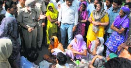 Police officials try to pacify protesters near the Barwala police post in Panchkula on Thursday.