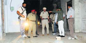 Police officials inspect the crime spot at Mullanpur on Thursday evening.