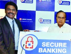 Vishal Salvi (L), Chief Information Security Officer, HDFC Bank and V V Choudhary (R) , Additional Commissioner of Police during the launch of Secure Banking--Cyber Crime Training programme in Delhi on Thursday. Tribune Photo 
