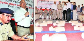 DIG Amit Sinha addresses a gathering at a workshop; (right) he interacts with officials at the 108 head office in Dehradun on Thursday