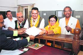 File in style: Tehri Garhwal Mala Raj Laxmi Shah files her nomination papers before the District Magistrate BVRC Puroshtam in Dehradun on Thursday