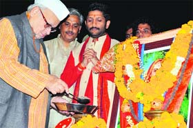 Seeking divine guidance: Governor Aziz Qureshi makes a symbolic offering by placing soil in the kalash in Dehradun on Thursday