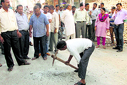 An MC officials dig the road to collect samples in Rewari on Thursday