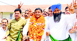 Harinder Sangwan (garlanded) after his election as Chairman of Zila Parishad in Karnal on Thursday