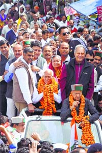 Chief Minister Virbhadra Singh with Congress candidate Chander Kumar and party workers in Dharamsala on Thursday.