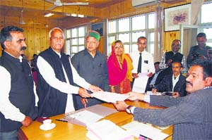 Congress candidate Chander Kumar files his nomination papers in Dharamsala on Thursday.