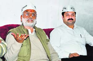 Aam Aadmi Party candidate Rajan Sushant addresses a press conference after filing his nomination in Dharamsala on Thursday