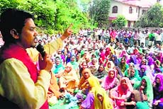 BJP Hamirpur candidate Anurag Thakur addresses an election meeting at Ispur village of Haroli on Thursday. 
