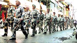 Paramilitary jawans conduct a flag march in Jalandhar on Thursday, ahead of the Lok Sabha elections. Photo: Sarabjit Singh