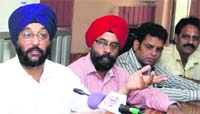 Members of the Jalandhar Corrugated Box Association address the media on Thursday. photo: Sarabjit Singh