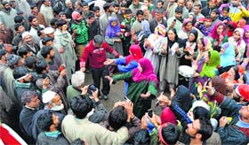NC supporters dance during Chief Minister Omar Abdullahs election campaign rally in south Kashmir's Pulwama district on Thursday.