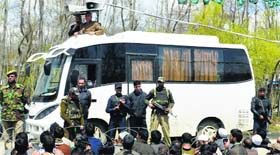 PDP leader Mufti Mohammad Sayeed addresses a gathering from a sunroof vehicle in Anantnag.