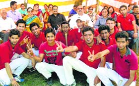 Members of a victorious team pose for a group photograph during the sports meet of the Jamwal Group of Educational Institutions in Jammu on Thursday.