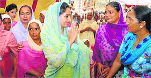 Bathinda MP Harsimrat Kaur Badal greets women during her election campaign.
