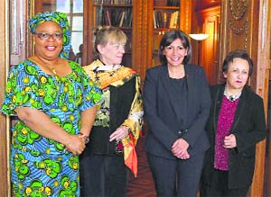Paris Mayor Anne Hidalgo (2nd from right) with three Nobel Peace Prize laureates (from left: Liberia's Leymah Gbowee, 2011, US' Jody Williams, 1997, and Iran's Shirin Ebadi, 2003) on the occasion of the 70th anniversary of the women's right to vote, at Paris city hall on Wednesday