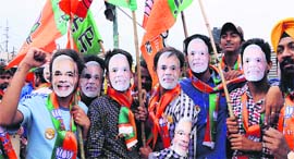 BJP supporters participate in an election campaign in Amritsar.