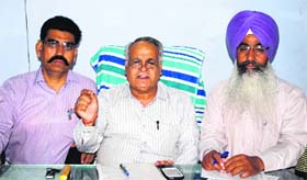Representatives of the pharmacists association announce the boycott of all emergency and VIP duties at the Civil Surgeon Office in Amritsar on Friday.
