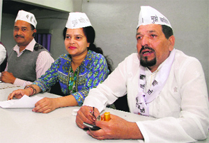 Aam Aadmi Party leaders address a press conference in Dehradun on Friday.