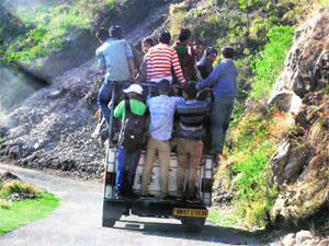  An overoladed vehicle plies on the Aglar-Thatyur road in the Jaunpur development region.