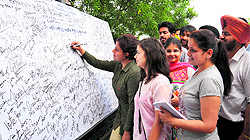 Department of Journalism and Mass Communication, GNDU Regional Campus, launches a signature campaign to make students aware about elections in Jalandhar on Friday