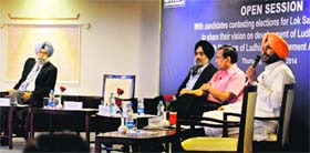 Congress candidate Ravneet Singh Bittu addresses an open session as AAPs HS Phoolka (extreme left) looks on. SAD-BJP candidate Manpreet Singh Ayali left early from the event organised by the Ludhiana Management Association on Friday.