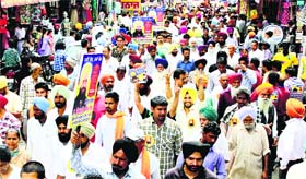 Supporters of Independent candidate Simarjit Singh Bains take out a rally in Ludhiana on Friday.