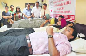 Volunteers donate blood in Ludhiana on Friday.