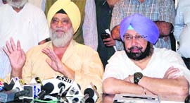Capt Amarinder Singh and Bishen Singh Bedi (left) at a press conference in Amritsar on Friday.