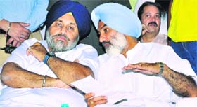 Exchanging notes: Deputy CM Sukhbir Badal (L) with SAD candidate Deepinder Dhillon in Rajpura on Friday.
