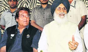 CM Parkash Badal with BJP leader Vinod Khanna in Pathankot on Friday.
