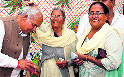 Women wishing luck to Congress candidate from Hoshiarpur Lok Sabha seat Mohinder Singh Kaypee during an election campaign in Hoshiarpur
