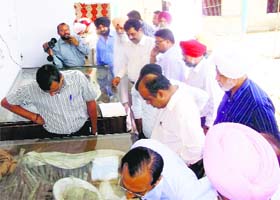 The team of the Archaeological Survey of India looks at the remains of martyrs at Kalianwala Khuh in Ajnala on Saturday