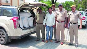 Drug trafficker Kaptan in police custody at the Rai police station on Saturday.