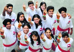Students of the GNIMT, Ludhiana, show the ink marks during a promotional programme. Tribune Photo