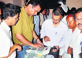 Presiding officers give demonstration of EVMs to polling officials in Guwahati, Assam, on Saturday