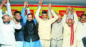 BJP leader Prakash Javadekar (third from left) with TDP supremo Chandrababu Naidu (centre) and other TDP legislators after the alliance for the Lok Sabha elections, in Hyderabad