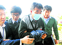 Lee Joon-seok (2nd R), captain of the sunken South Korean ferry, arrives at the headquarters of an investigation team of prosecutors and police in Mokpo on Saturday