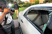 The damaged car of journalist Hamid Mir parked at a hospital in Karachi on Saturday